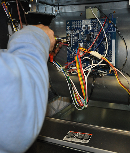 Service Technician Doing A Heating Repair