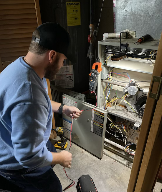 Service Technician Doing A Heating Repair